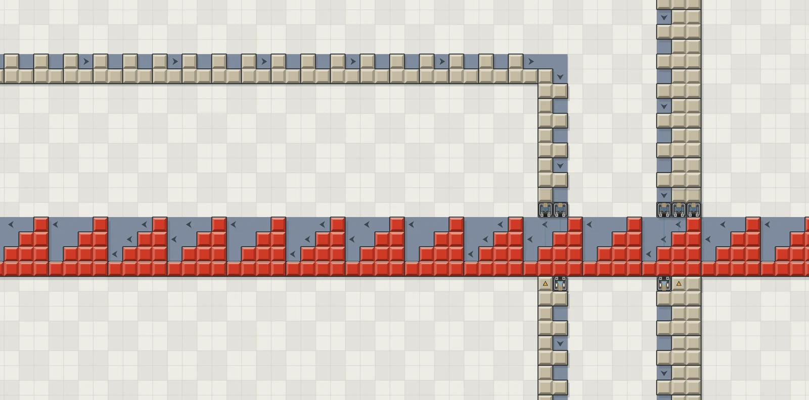 Two lanes crossing: one packed end to end with red stepped roof pieces, the other with tan wall blocks
